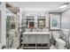 Elegant bathroom with double vanity, glass enclosed shower with tile surround and modern fixtures at 8 Colonial Club Se Dr, Acworth, GA 30102