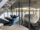 Spacious boat dock featuring boat slips, seating and staircase to a deck overlooking the water at 8 Colonial Club Se Dr, Acworth, GA 30102