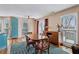 Dining room with windows that provide natural light, hardwood floors, and a decorative rug at 8 Colonial Club Se Dr, Acworth, GA 30102