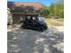 Spacious driveway with ample parking and a utility vehicle at this lovely home at 8 Colonial Club Se Dr, Acworth, GA 30102
