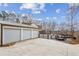Three-car garage and spacious drive with gated access to the pool and yard space at 8 Colonial Club Se Dr, Acworth, GA 30102