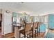 Well-designed kitchen featuring a breakfast bar, stainless steel appliances, and bright blue cabinetry at 8 Colonial Club Se Dr, Acworth, GA 30102