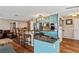 This open kitchen has an island bar with seating, stainless steel appliances, and stone counter tops at 8 Colonial Club Se Dr, Acworth, GA 30102