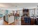 Open concept living space featuring a kitchen island, fireplace, and hardwood floors at 8 Colonial Club Se Dr, Acworth, GA 30102