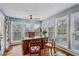 Sun-lit office with a large wooden desk, lots of windows, and hardwood floors at 8 Colonial Club Se Dr, Acworth, GA 30102