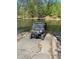 Utility vehicle on a boat ramp leading to the lake at 8 Colonial Club Se Dr, Acworth, GA 30102