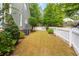 Well-maintained backyard features a white picket fence and lush green grass at 2149 Whittier Nw Pl, Atlanta, GA 30318