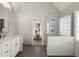 Well-lit bathroom features a walk-in shower with glass door and marble tile, a vanity, and an open doorway at 2149 Whittier Nw Pl, Atlanta, GA 30318
