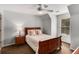 Cozy bedroom with a queen-sized bed, a ceiling fan, a neutral color palette, and a window for natural light at 2149 Whittier Nw Pl, Atlanta, GA 30318