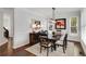 Elegant dining room with a dark wood table, chandelier, and bright natural light at 2149 Whittier Nw Pl, Atlanta, GA 30318