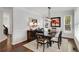 Dining room featuring large windows, wainscotting and a dark wood table with seating for six at 2149 Whittier Nw Pl, Atlanta, GA 30318