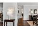 Elegant hallway featuring hardwood floors, stylish decor, and a view of the dining area at 2149 Whittier Nw Pl, Atlanta, GA 30318