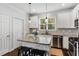 Well-equipped kitchen features stainless steel appliances, granite countertops, and a center island with bar seating at 2149 Whittier Nw Pl, Atlanta, GA 30318