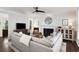 Inviting living room with a fireplace, large gray sofa, and stylish decorations at 2149 Whittier Nw Pl, Atlanta, GA 30318