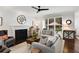 Bright living room with a fireplace, large windows, and comfortable gray sectional sofa at 2149 Whittier Nw Pl, Atlanta, GA 30318