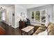 Comfortable home office area featuring a desk, couch, and bright, natural light at 2149 Whittier Nw Pl, Atlanta, GA 30318