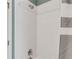 Close-up of a shower featuring white tiles, a chrome shower head, and a striped shower curtain at 2149 Whittier Nw Pl, Atlanta, GA 30318