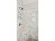 Elegant walk-in shower with marble walls and mosaic-tiled floor, complete with a showerhead and built-in seat at 2149 Whittier Nw Pl, Atlanta, GA 30318