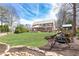 Spacious backyard with a large lawn, playset, and covered outdoor living area for Gathering fun at 3338 Breton Ne Cir, Brookhaven, GA 30319