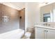 Charming bathroom with tiled shower, white vanity, and neutral color scheme at 3338 Breton Ne Cir, Brookhaven, GA 30319