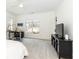 Bedroom with gray carpet, white walls, and an adjustable desk by the window at 3338 Breton Ne Cir, Brookhaven, GA 30319