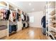 Spacious closet with custom shelving, hanging rods, drawers, and dedicated shoe storage at 3338 Breton Ne Cir, Brookhaven, GA 30319