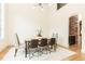 Bright dining room with seating for six, hardwood floors, and modern lighting at 3338 Breton Ne Cir, Brookhaven, GA 30319