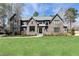 Stately brick home with a well-maintained lawn and large windows at 3338 Breton Ne Cir, Brookhaven, GA 30319