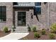 Charming front entrance with a stylish door, stone steps, and landscaped bushes at 3338 Breton Ne Cir, Brookhaven, GA 30319