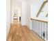 Hallway with hardwood floors, white walls, and an exposed beam ceiling at 3338 Breton Ne Cir, Brookhaven, GA 30319