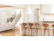 Modern kitchen island with seating, pendant lighting, and views into the open concept living area at 3338 Breton Ne Cir, Brookhaven, GA 30319