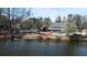 Expansive lake view with community amenities including a pool, playground, and clubhouse at 3338 Breton Ne Cir, Brookhaven, GA 30319