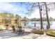 Scenic lake view with a boat launch and rocking chairs for relaxing at 3338 Breton Ne Cir, Brookhaven, GA 30319