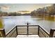Scenic view of the calm lake from a wooden dock, featuring a steel and wood mechanism at 3338 Breton Ne Cir, Brookhaven, GA 30319