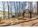 Shady lakeside path with boats, picnic tables and a decorative archway, perfect for strolling at 3338 Breton Ne Cir, Brookhaven, GA 30319