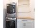 Efficient laundry area with stacked washer/dryer and storage cabinetry at 3338 Breton Ne Cir, Brookhaven, GA 30319