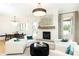Bright living room with a white fireplace and a seating area for entertaining guests at 3338 Breton Ne Cir, Brookhaven, GA 30319