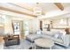 Open-concept living room with stylish furniture, hardwood floors, and a seamless transition to the kitchen at 3338 Breton Ne Cir, Brookhaven, GA 30319