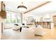 Open-concept living space features a fireplace and kitchen island, creating a warm and inviting atmosphere at 3338 Breton Ne Cir, Brookhaven, GA 30319