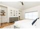Stylish main bedroom with white shiplap vaulted ceiling, a ceiling fan, and built in shelving at 3338 Breton Ne Cir, Brookhaven, GA 30319