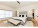 Elegant bedroom with vaulted ceilings, a large bed, a walk-in closet, and a cozy rug at 3338 Breton Ne Cir, Brookhaven, GA 30319