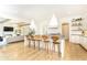 Open concept kitchen with island, pendant lighting, and hardwood floors, perfect for entertaining guests at 3338 Breton Ne Cir, Brookhaven, GA 30319