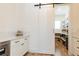 Organized pantry with white shelves, sliding barn door, and hardwood floors at 3338 Breton Ne Cir, Brookhaven, GA 30319