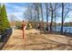 Community playground with swings and slides, located by the lake with a fenced-in perimeter at 3338 Breton Ne Cir, Brookhaven, GA 30319