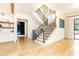 Beautiful staircase with hardwood floors and black iron railings, leading to the upper level of the home at 3338 Breton Ne Cir, Brookhaven, GA 30319