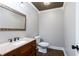 Powder room with dark wood vanity and tile floors at 3485 Sheree Trl, Stone Mountain, GA 30087