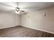 Spacious bedroom featuring hardwood flooring and a ceiling fan with a light at 3485 Sheree Trl, Stone Mountain, GA 30087
