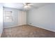 Bedroom featuring neutral walls, plush carpet, and a window for natural light at 3485 Sheree Trl, Stone Mountain, GA 30087