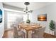 Bright dining room with natural light, modern chandelier, and seating for six at 3485 Sheree Trl, Stone Mountain, GA 30087