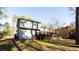A view of the back of the house shows a multi-level wooden deck at 3485 Sheree Trl, Stone Mountain, GA 30087